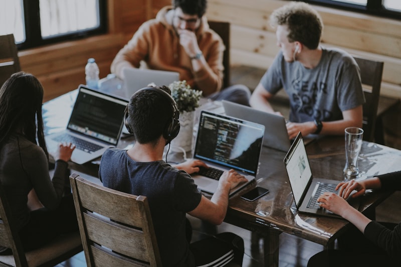 Small team in a focused discussion around a table
